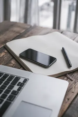 Modern Office Desk With Laptop and Notebook