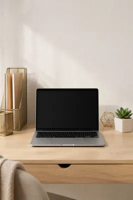 Blank Laptop Workspace With Gold Organizers