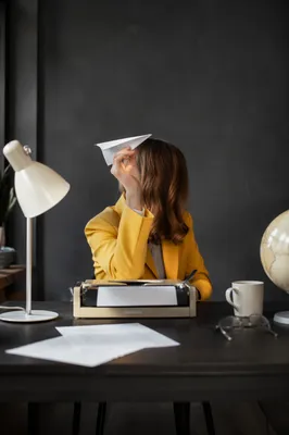 Paper Airplane Innovation on Office Desk