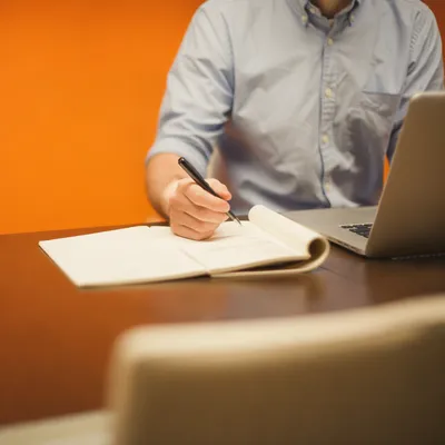 Professional Writing Email at Laptop Desk