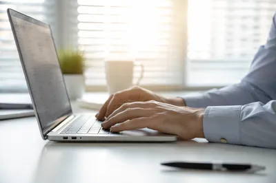 Professional Typing Email at Modern Office Desk