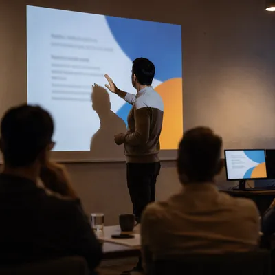 Business Presentation Projection in Dark Conference Room
