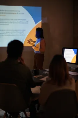 Business Presentation Projection in Dark Conference Room