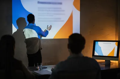 Business Presentation in Dark Conference Room