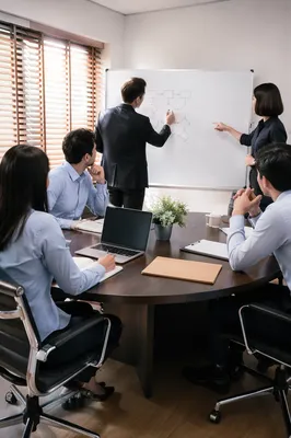 Modern Team Brainstorming at Whiteboard