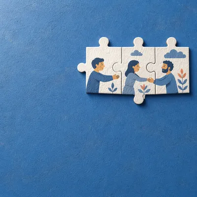 White Puzzle Pieces on Blue Teamwork Background