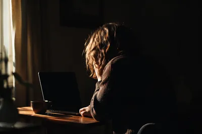 Focused Remote Worker in Moody Home Office