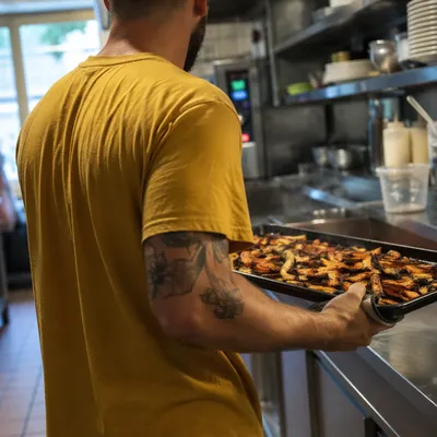 Busy Restaurant Kitchen Worker Preparing Roasted Food