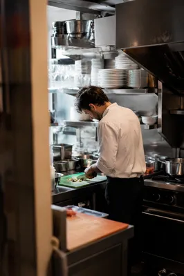 Chef Preparing Vegetables in Professional Kitchen