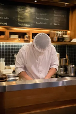Professional Chef in Warm Restaurant Kitchen