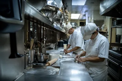 Professional Chefs Preparing Fresh Dough
