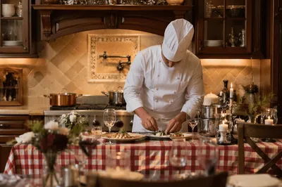 Professional Chef Cooking in Warm Restaurant Kitchen