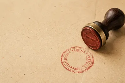 Rubber Stamp Approval on Beige Document