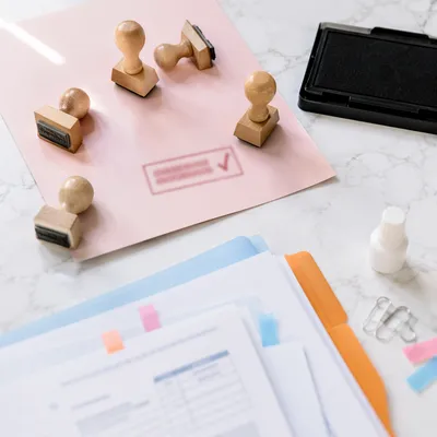 Rubber Stamp Approval on Pink Document