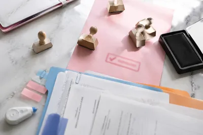 Rubber Stamp Approval on Marble Desk
