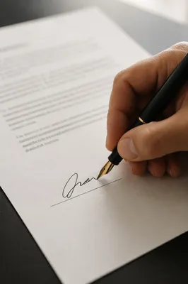 Hand Signing Business Contract with Fountain Pen