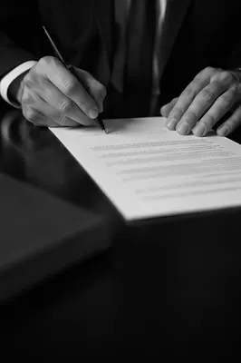 Professional Contract Signing on Dark Desk