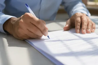Business Contract Signing with Blue Pen