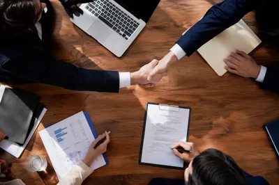 Business Contract Signing and Handshake Meeting