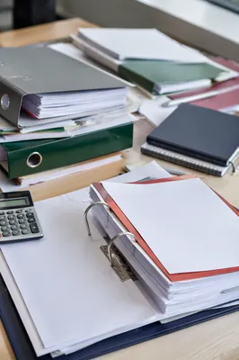 Stacked Office Documents and Folders Desk Scene