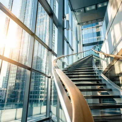 Ascending Staircase in Modern Office Atrium