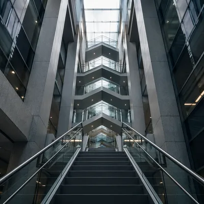 Ascending Staircase in Modern Office Atrium