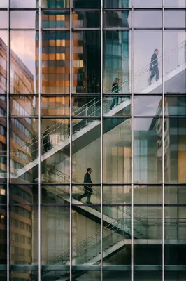 Ascending Office Staircase Behind Reflective Glass