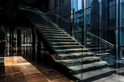 Ascending Staircase in Modern Office Atrium