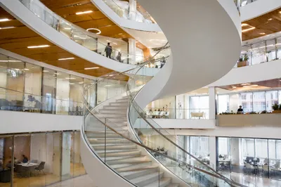 Ascending Spiral Staircase in Modern Office Atrium