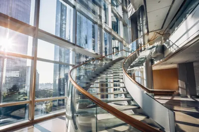 Ascending Staircase in Modern Office Atrium