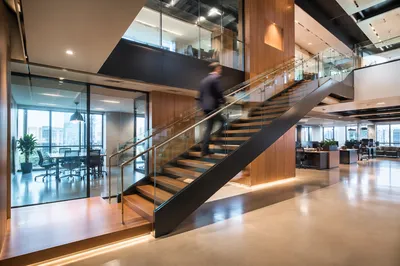 Ascending Staircase in Modern Office Atrium