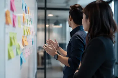Modern Office Team Brainstorming with Sticky Notes
