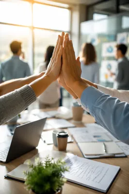 Team High Five Celebration in Modern Office