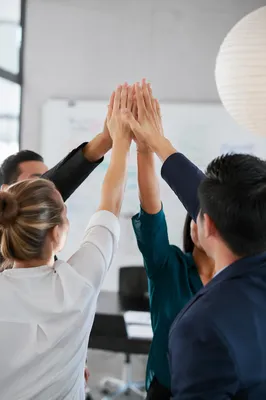 Office Team Celebrating Success with High Five