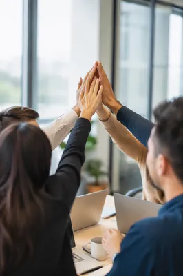 Team High Five in Modern Office