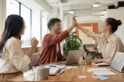 Diverse Office Team Celebrating Project Success