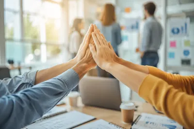 Team High Five Celebration in Modern Office