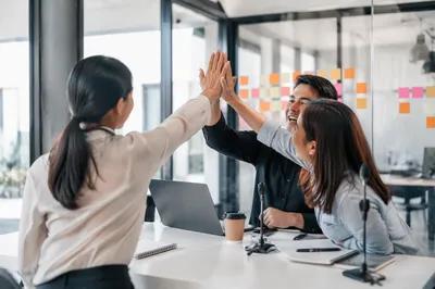 Startup Team High Five in Modern Office