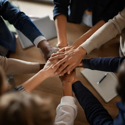 Diverse Business Team Hands in Unity