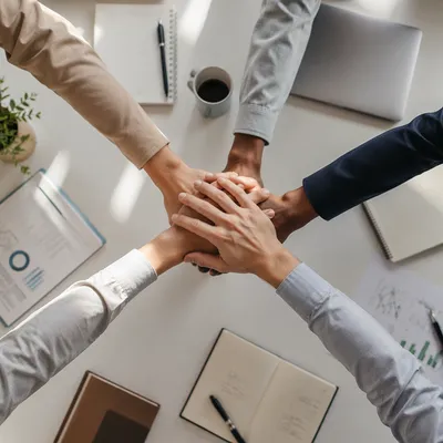 Overhead Team Hands Stacked for Unity