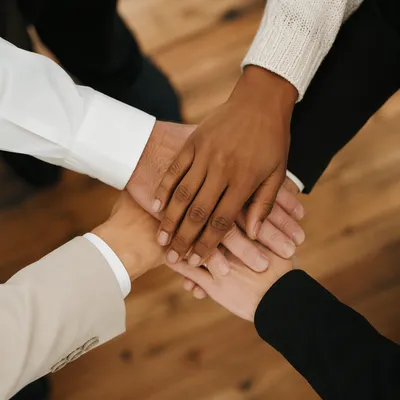 Diverse Business Team Hands in Unity