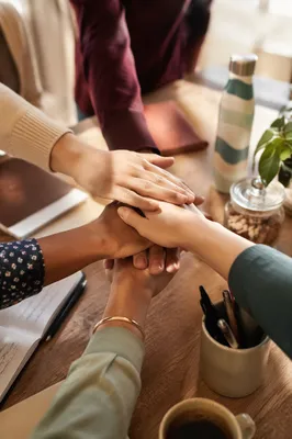 Diverse Team Hands Stacked in Unity