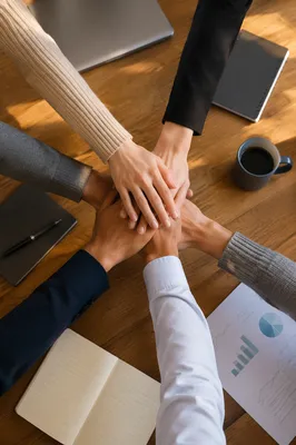 Business Team Hands Stacked in Unity