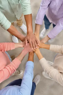Diverse Team Hands Stacked in Unity