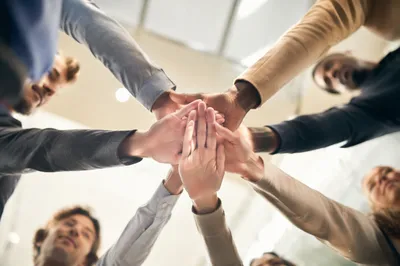 Diverse Team Hands United in Office