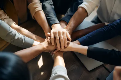Diverse Business Team Hands in Unity