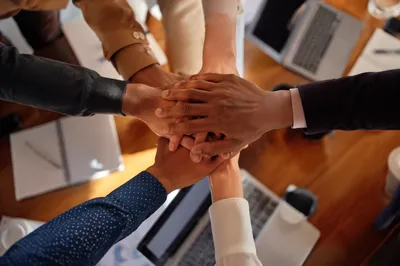 Diverse Business Team Hands in Unity