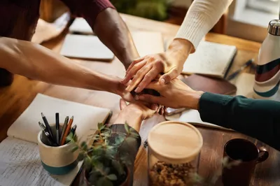 Overhead Team Hands in Office Unity