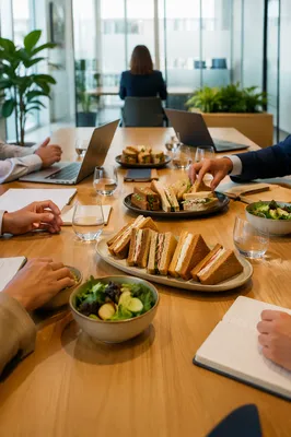 Collaborative Team Lunch on Conference Table