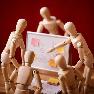Team Brainstorming Around Whiteboard Concept
